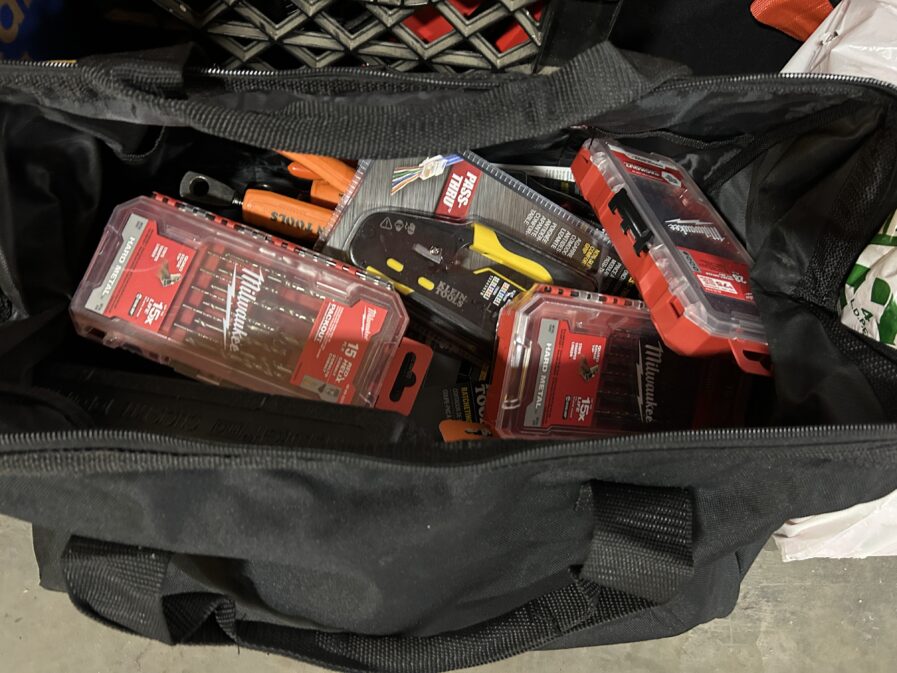 photo of black bag with tools inside 